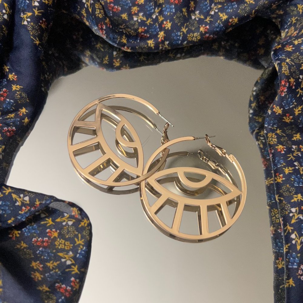 Sunburst eye earrings